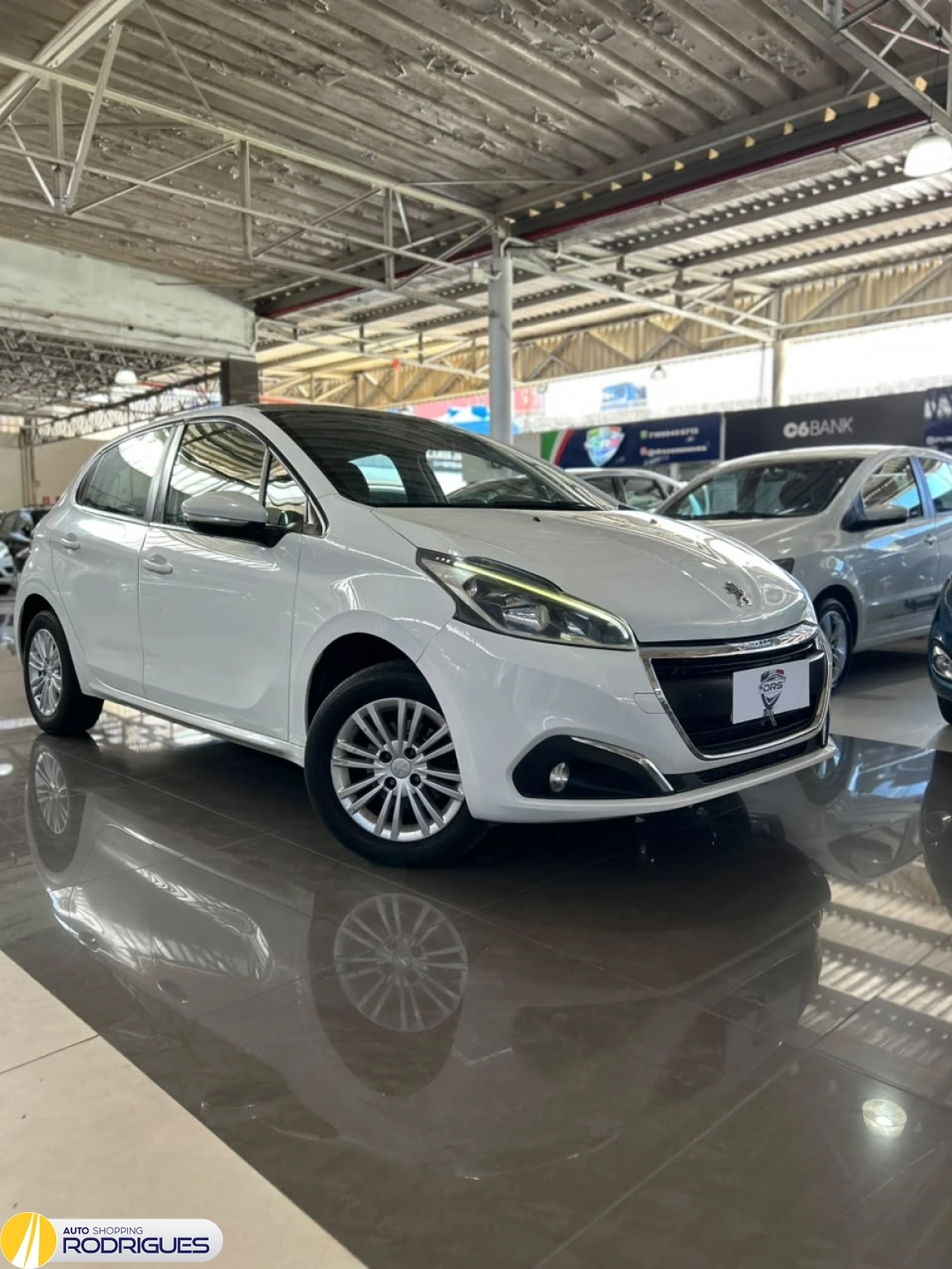 Peugeot 208 · veículo de exemplo